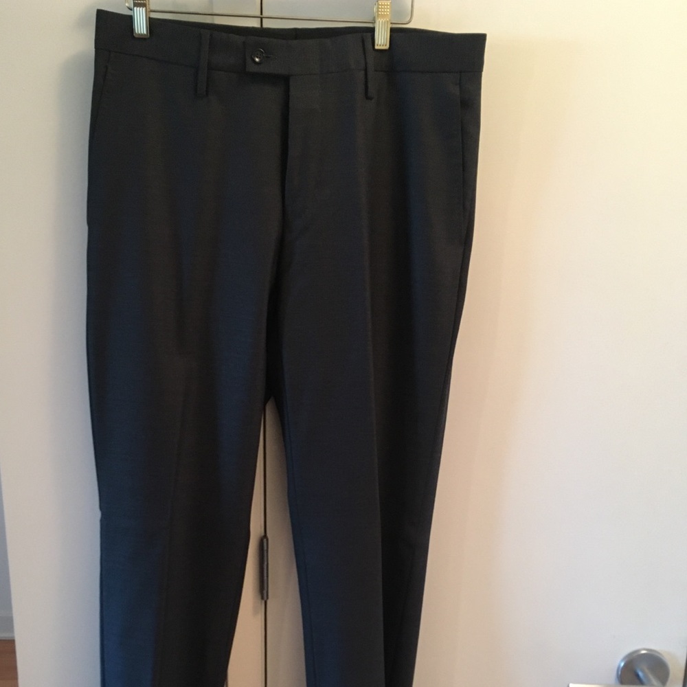 Men’s Gucci Charcoal Wool flat front dress pants.